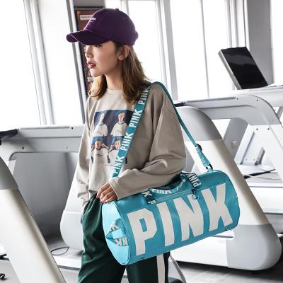 China Fashion Nylon Design Customized Logo Foldable Travel Woman Men Large Capacity Pink Waterproof Duffle Sports Gym Bag Luggage for sale