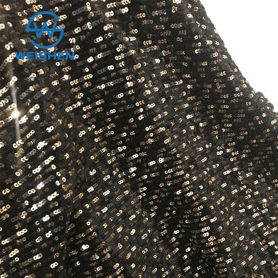 China Memory Straight Line Mesh Embroidery Wholesale Black And Gold 3mm Sequin Embroidered Fabric for sale