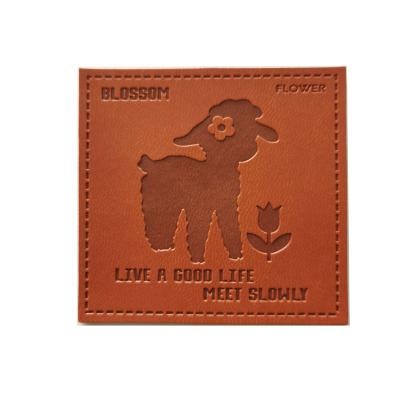 China Sustainable Customized Artificial Brand Logo PU Embossed Patch Real Leather Cowhide Debossed Patch For Hats / Garment for sale