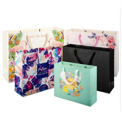 China Wholesale Cheap Eco-Friendly Wholesale Eco-Friendly Brand Shopping Bags Customized High Quality Luxury Paper Handbags For Clothing for sale