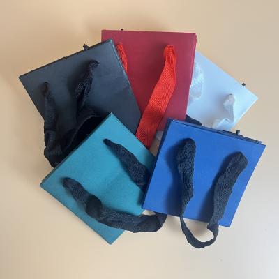 China Beautiful recyclable navy blue square shopping paper bag with handel for jewelry and gifts and small box size 10mm*10mm*10mm for sale