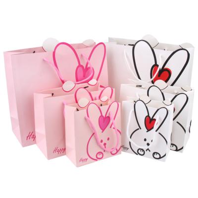 China Recyclable Candy Flowers Paper Bag Shopping Decorative Kids Coat Paper Bag for sale