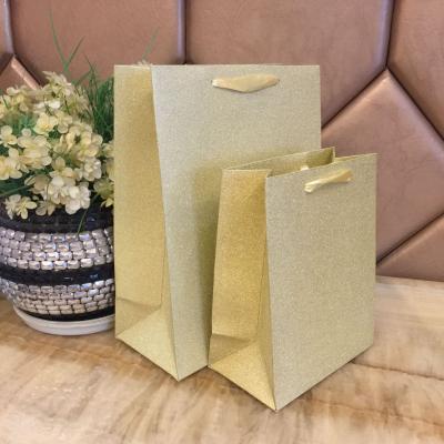 China Recyclable in stock high end handbags frosted gold and silver glitter film gift bags gift wrap paper bags for sale