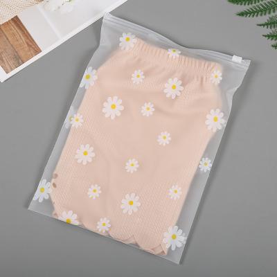 China Large Size BIODEGRADABLE Daisy Printed Frosted Zipper Bag Plastic Packaging Bag Zipper Lock Bag For Garment Clothing for sale