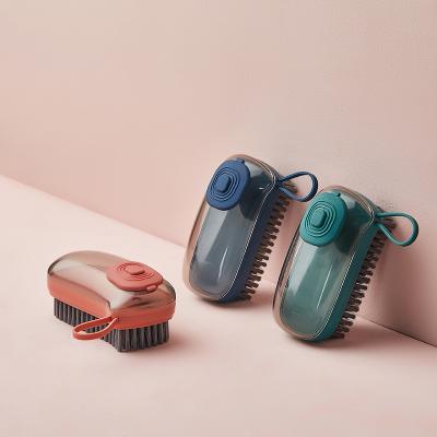 China Sustainable Household Durable Hydraulic Cleaning Brush For Clothes Shoes Laundry Soft Brush With Soap Dispenser for sale