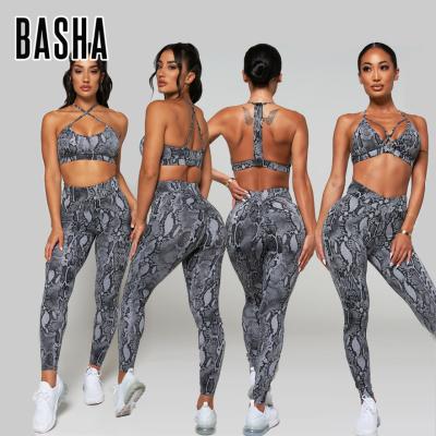 China CuBASHAsports Breathable stomize Women's Gym Fitness Yoga Set Cross Front One Shoulder Bra Scrunch Printed Butt Lift Pants Plus Size for sale