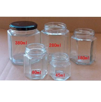 China Wholesale Food Clear Hexagon Glass Honey Jar With Screw Metal Lid for sale