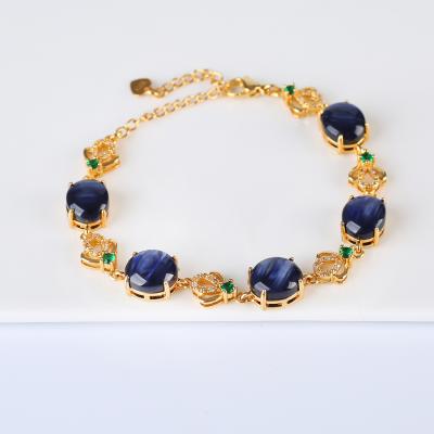 China DIY Handmade Blue Oval Glass DIY Handmade Crystal Tiger Eye Inlaid Bracelet 14k Gold Plated for sale