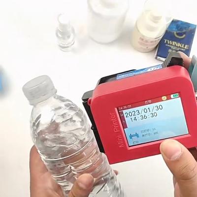 China Quick Drying Ink 12-12.7mm Mini Handheld Printer for Food Bag Bottle Body Production Date for sale