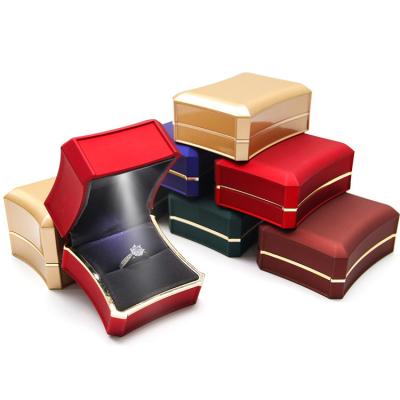 China Jewelry Packaging Customize Attractive Beautiful Logo Rectangle Jewelry Boxes With Led Light for sale