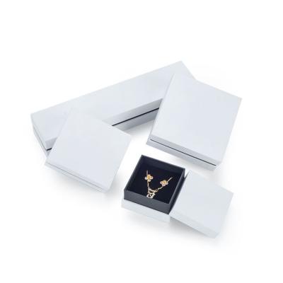 China Luxury Custom Jewelry Ring Boxes White And Black Jewelery Packaging Box With Lid for sale