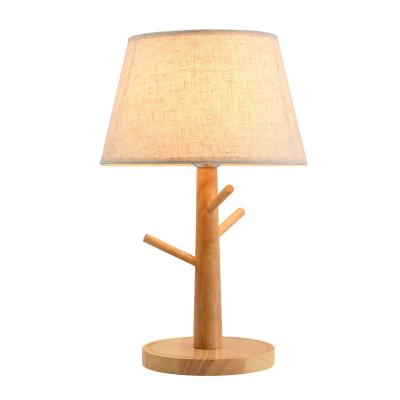 China Modern Nordic solid wood table lamp fabric warm simple bedside wood bedroom LED decorative lights for sale