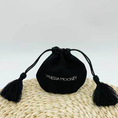 China Recyclable Promotional Black Suede Pouch Jewelry Pack Around Bag With Tassel Drawstring Suede for sale