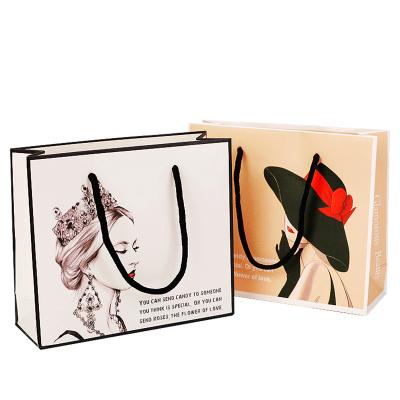 China Customized Handmade Logo Design Luxury Paper Bag Gift Packaging Bag Gift Paper Bags With Ribbon Handle for sale