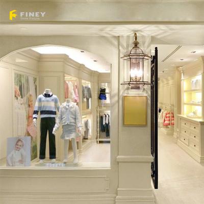 China Wholesale Modern Fashion Baby and Kids Clothing Store Display Furniture Store High End Interior Design for sale