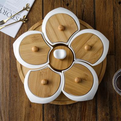 China Viable Plum Blossom Shape Porcelain Dry Food Nuts Candy Snack Dish with Bamboo Lid and Stand for sale