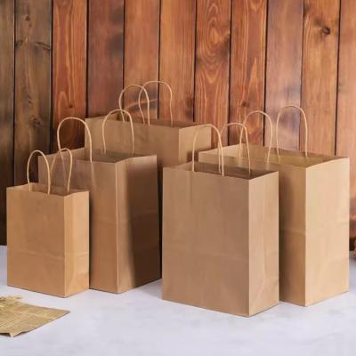 China Recycled Materials High Quality Waterproof Handle Fashion Personalisable Party Reusable Carrier Paper Shopping Bag Manufacturers for sale