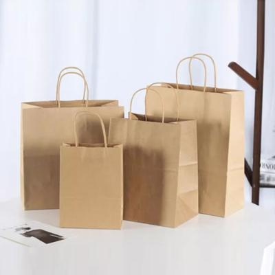 China Recycled Materials Hot Selling Need Eco Friendly Bag/Cloth Logo Luxury Boutique Clothing Kraft Paper Shopping Bag Custom Print Light for sale