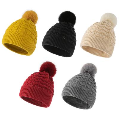 China COMMON Custom Winter Knit Solid Color Streetwear Knit Cap Hats Winter Beanie Hat With Pom for sale