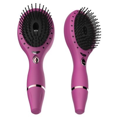 China New Rechargeable Battery Powered Massage Ionic Hair Brush With Developed Vibrating Hair Therapy LED Light Hair Comb for sale