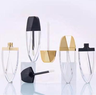 China Creative Hot Sale Gold Diamond Cosmetic Black Foil Shaped Lipstick Lip Gloss Container Cosmetic Packaging Tubes With Magic Wands Brush 7ml for sale