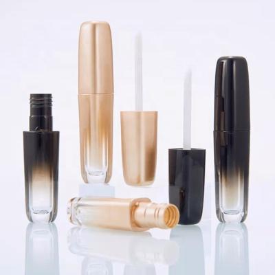 China New Style Lipstick Gradient Gold Lip Gloss Container Cosmetic Tubes Unique Black Empty Cosmetic Gloss Packaging With Magic Wands Brush for sale