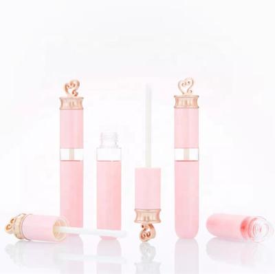 China New style low moq gold heart lipstick top lipstick cosmetic hollow lip gloss tubes container unique cosmetic lip gloss packaging for girls 5ml for sale