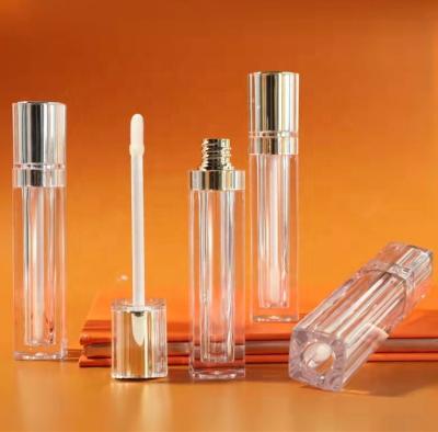 China New Style Gold Lip Sliver Luxury Clear Lip Gloss Bottle Packaging Wand Wand Tubes Cosmetic Empty Gloss Square Top Container With Brush for sale