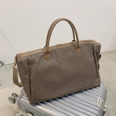 China Vintage Polyester Small MOQ Women's Travel Duffel Bag Custom Logo From Manufacturer for sale