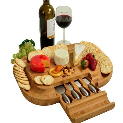 China Sustainable Bamboo Cheese Board With 4 Drawer Stainless Steel Cheese Knives for sale