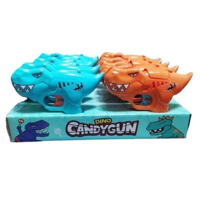 China Cartoon Toys Wholesale Pops Dinosaur Lollipop Gun Shooter Toy Sugar Candy Gun Sweet Toy for sale