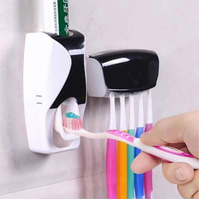 China Sustainable Promotional Family Dustproof Toothpaste Wall Mounted Kids Hands Free Toothpaste Squeezer Toothbrush Holder Toothpaste Dispenser for sale