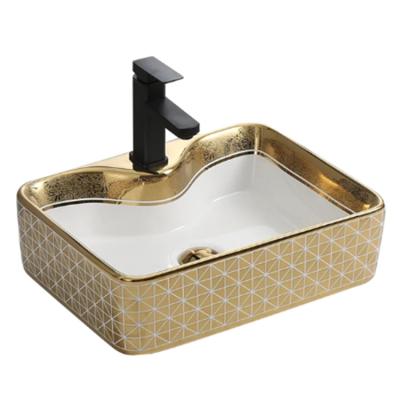 China New Design Table Top Face Hand Wash Basin Easy Clean Porcelain Gold Ceramic Bathroom Sink for sale