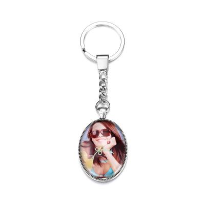 China Sublimation Fashionable High Quality Metal Glass Environmental Protection Design Fashion Key Chain for sale