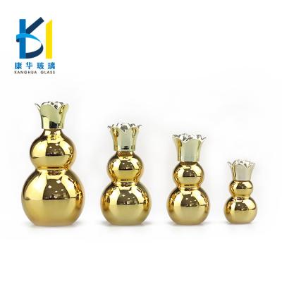 China Best Personal Care Plating Gold Gourd Shape Essential Oil Glass Bottles With UV Plastic Cover for sale