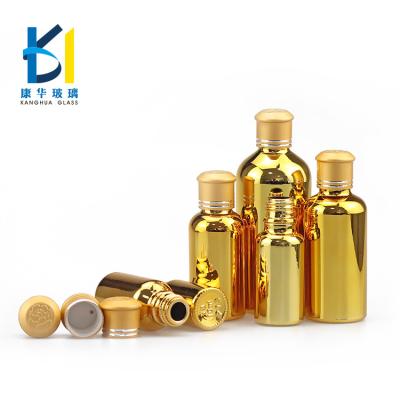 China Recyclable Material Glass Hardware Gold Plating Surface Handling Round And Shape Essential Oil Glass Bottle for sale