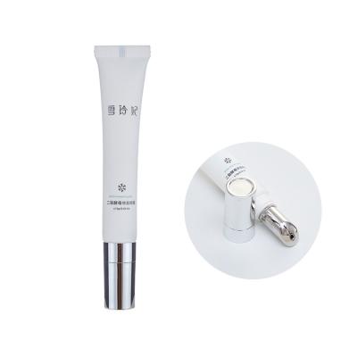 China Custom skin care cream tube packaging eyecream container tube compression packaging tube with alloy metal massage applicator for sale