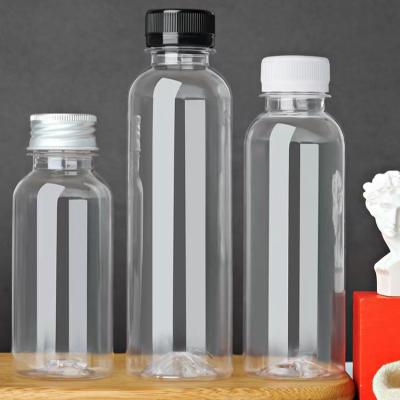 China Reusable Transparent Disposable Beverage Milk Bulk Containers With Tamper Evident Caps Empty Plastic PET Juice Bottles for sale