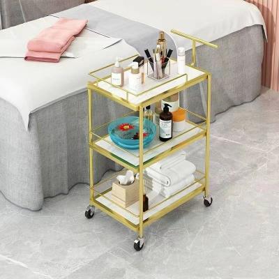 China Modern Modern Luxury Trolleys For Beauty Salon Furniture Nail Gold Hair SPA salon furniture can be moved rotating beauty tram for sale