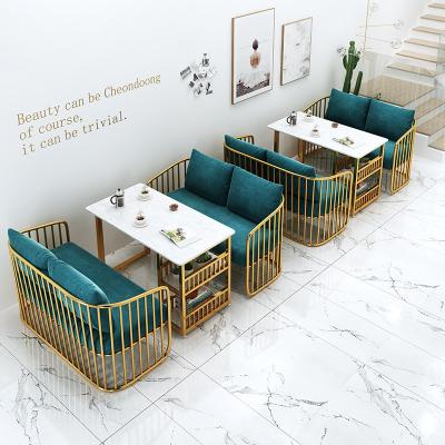 China Modern Modern Modern style design golden iron sofa Hotel restaurant Milk tea shop cafe lounge area Sofa table and chair set furniture for sale