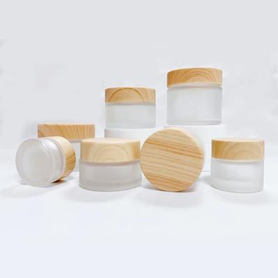 China Customizable Hot Sale Cosmetics Package 5g 10g 15g 20g 30g 50g Bamboo Cap Frosted Glass Empty Cosmetic Cream Jar for sale