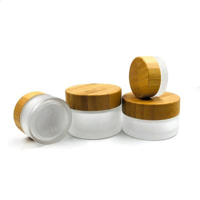 China Wholesale 1oz 5g 15g 30g 50g 100g Skin Care Empty Luxury Frosted Glass Cosmetic Cream Jar With Bamboo Lid for sale