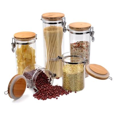 China Microwavable Locking Hold Lid Bamboo Borosilicate Around Straight Sided Kitchen Food Glass Storage Jar For Spice Candy Rice Spaghetti for sale