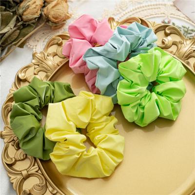 China Daily Life Hair Ties 2021 New Hair Cloth Hair Accessories Ponytail Women Elastic Flip Hair Scrunchies Waterproof Wholesale Hair Ties For Summer for sale