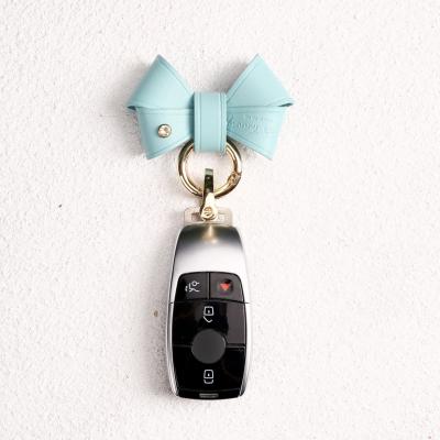 China Cute Genuine Leather Bow Key Chain Internet Cute Dangling Leather Celebrity The Same Style Car Key Chain Female Keychain for sale