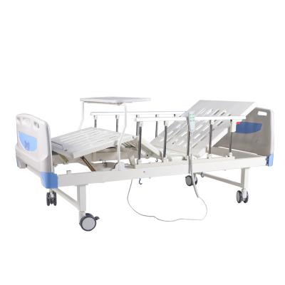 China Hospital clinic Two-function electric hospital bed equipped with dining table above bed table for sale