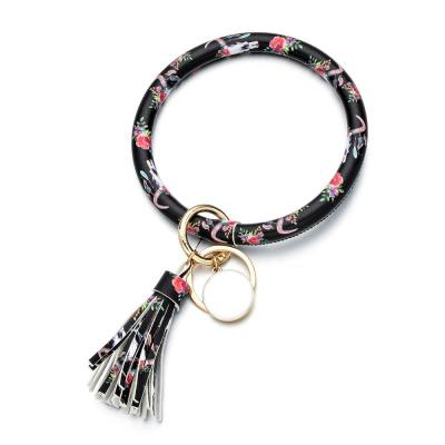 China Promotion Gift Key Chain Bracelet Wrist Bangle Key Chain With Leather Tassel for sale