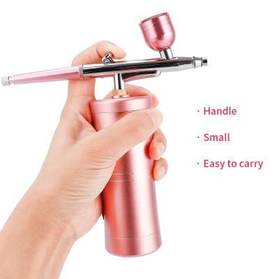 China Mini Gift Handheld Cordless Airbrush Oxygen Facial Spray Gun for sale