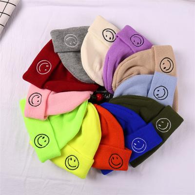 China Wholesale beaniecute warm smiley face embroidery cap winter hats COMMON knitted woolen hat for sale