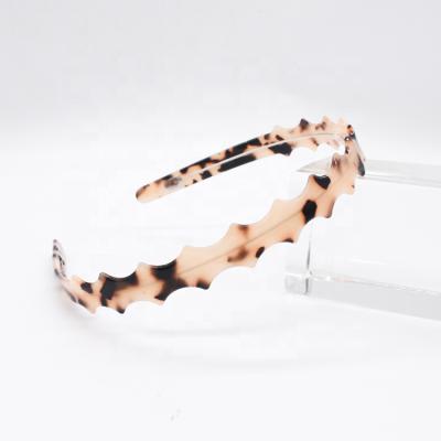 China Popular Toothed Leopard Style Girl Friendly Material Plastic Crown Headbands Toothed Cheap Headbands for sale